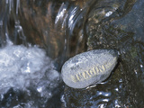 Rock with the Word Imagine in Rushing Water Photographic Print