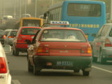 A Taxi in Traffic Photographic Print by Richard Nowitz