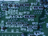 Close View of Computer Circuitry Board Connections Soldered Together Photographic Print by Taylor S. Kennedy