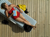 Woman Sleeping on the Deck of a Cruise Ship Lámina fotográfica por Todd Gipstein