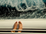 Woman's Feet Standing on the Railing of a Cruise Ship with Sea Below Lámina fotográfica por Todd Gipstein