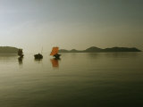 Cluster of Kabangs Reflected in a Quiet Sea at Dusk Photographic Print by Nicolas Reynard