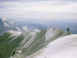 Mountain Climber Hikes along a Mountain Ridge in Denali Photographic Print by Bill Hatcher