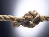 Brown Fiber Rope Knot in Spotlight Photographic Print