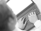 Caucasian Business Man Typing on Black Laptop Computer Photographic Print