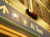 Italian Sign in Train Station Pointing to Luggage Area Photographic Print