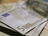 Stack of Paper Money Is Topped by a 5 Euro Bill Photographic Print by Stephen Alvarez