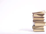 Stack of Worn Hardcover Books with Yellowed Pages Photographic Print