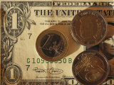 Euro Coins on Top of an American Dollar Bill Photographic Print by Stephen Alvarez