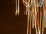 Colorful Streaks and Swirls of Light Against a Black Background Lámina fotográfica Colorful Streaks and Swirls of Light Against a Black Background Lámina fotográfica