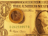 Euro Coin Lies on Top of an American Dollar Bill Photographic Print by Stephen Alvarez