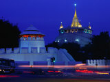 Illuminated Golden Mount at Wat Saket and Democracy Monument Bangkok, Thailand Photographic Print by Tom Cockrem