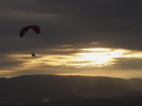 A Botanist Flies over a Field in a Powered Paraglider Photographic Print by Jim Webb