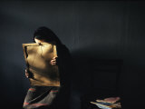 A Grieving Woman Holds a Photograph of Her Murdered Son Photographic Print by James L. Stanfield