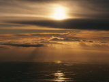 Sunset and Clouds over the Ocean Photographic Print by Peter Carsten