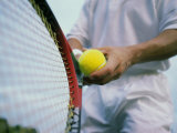 Man Holding a Tennis Ball And a Tennis Racket Photographic Print