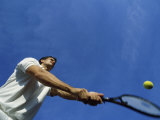 Tennis Player with Blue Sky Photographic Print