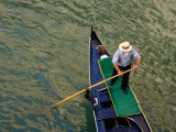 A Gondolier Steers His Craft Through a Canal, Venice, Veneto, Italy Photographic Print by Glenn Beanland