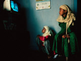 Muslim Girls Relax Watching Television, Indonesia Photographic Print by Adams Gregory
