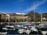 Yachts in Harbour at Intra with Old Town and Mountains in Background, Lago Maggiore, Italy Photographic Print by Martin Moos