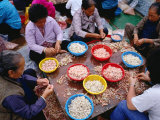 Women Peeling Prawns on Table in Cheng Chau, Hong Kong Photographie par Jon Davison