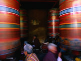 Pilgrims Turning Giant Prayer Wheels in the National Chorten of Thimphu, Thimphu, Bhutan Photographic Print by Izzet Keribar