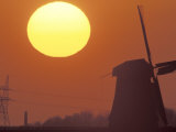 Sun Setting Over Windmill Photographic Print