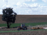 Tractor Ploughing Field Photographic Print