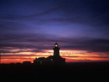 Lumière du phare la nuit, Espagne Photographie par David Marshall
