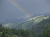 A Rainbow Bridges Lamar Valley Near Specimen Ridge after a Rain Storm Photographic Print by Raymond Gehman