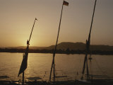 Moored Feluccas on the Nile River at Sunset Lámina fotográfica por Kenneth Garrett Moored Feluccas on the Nile River at Sunset Lámina fotográfica por Kenneth Garrett
