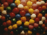 A Colorful Close View of Gumballs Behind Glass Photographic Print by Stephen St. John