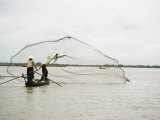 Fishermen Cast out a Net into the Mekong River Photographic Print by W. E. Garrett