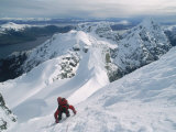 A Mountain Climber Scrambles up a Steep, Rime-Covered Slope Photographic Print by Gordon Wiltsie