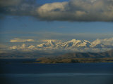 A View of Lake Titicaca Across to the Snow-Capped Andes Mountains Photographie par Kenneth Garrett