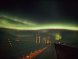 The Aurora Borealis Streaks Across the Evening Sky Photographic Print by Norbert Rosing