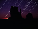 Star Streaks Above the Silhouetted Mitten Buttes Photographic Print by Michael Nichols