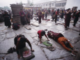Buddhist Pilgrims Outside Jokhang Temple in Lhasa, Tibet Photographic Print by Gordon Wiltsie