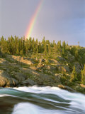The Mist-Filled Tides of Clearwater River Wash against a Rocky Shore Where a Ra Inbow Takes Form Photographic Print by Barry Tessman
