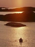 Rowboat Heads Toward a Series of Low-Lying Islands at Twilight Photographic Print by Thomas J. Abercrombie