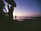 A Surfer Unloads a Board at Dawn in East Cape of Baja, Mexico Photographic Print by Jimmy Chin