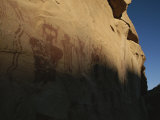 Indian Pictographs Cover a Sandstone Wall Photographic Print by Stephen Alvarez