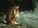 A Pinare Indian Sits by a Stream Fishing Photographie par Ed George