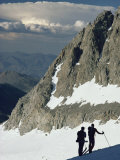 Skiers Contemplate a Storm Cloud over the White Mountains in Nevada Photographic Print by Gordon Wiltsie