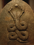 The Image of a King Cobra Carved on the Surface of a Stone Photographic Print by Mattias Klum