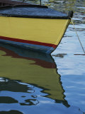 The Bow of an Anchored, Striped Boat is Reflected on the Water Photographic Print by Michael Melford
