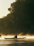 A Kayaker Paddles Through the Mist in the Low Sunlight Photographic Print by Skip Brown