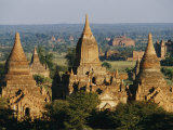 Buddhist Temples with Large Conical Tops Reach Heavenward Fotografisk tryk af Paul Chesley Buddhist Temples with Large Conical Tops Reach Heavenward Fotografisk tryk af Paul Chesley