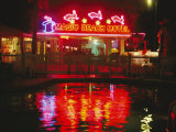 The Magic Beach Motel Sign Reflects in the Motel Pool Photographic Print by Stephen St. John