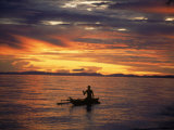 Native Fisherman in Outrigger Canoe, Indonesia Photographic Print by Yvette Cardozo